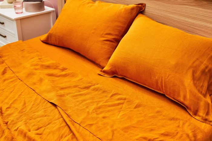 A bed made with the Everly Hemp Sheet Set