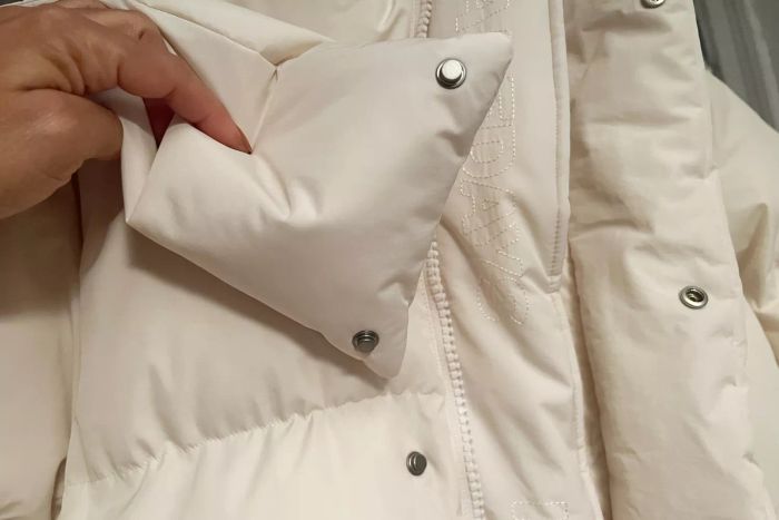 Close-up view of the snaps on the Halfdays Wheeler Parka