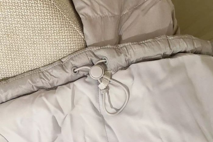 A detailed view of the hood adjustment feature on the lululemon Wunder Puff Cropped Jacket