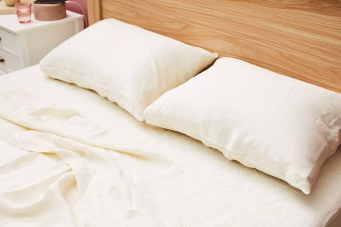 A bed made using the Avocado Organic Hemp Sheets.