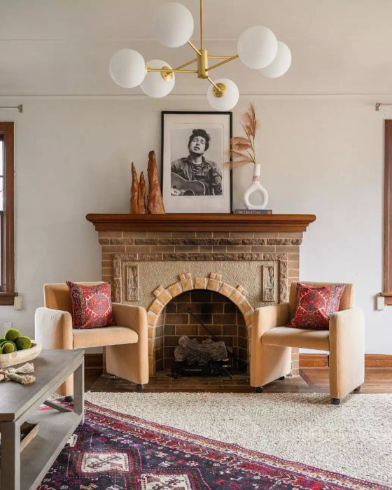 Artistic sculptures atop the fireplace mantel.