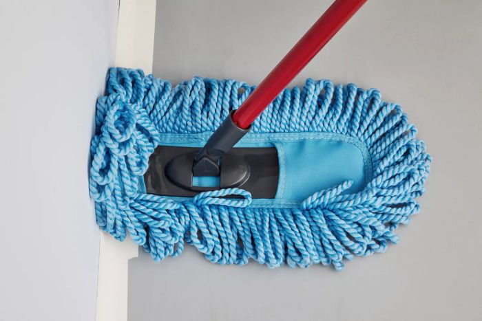 The O-Cedar Dual-Action Microfiber Sweeper Dust Mop is being used to clean surfaces.