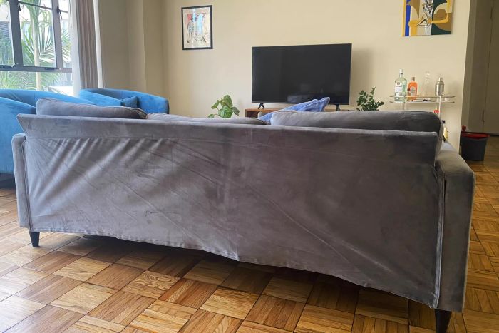 The Walmart DHP Cooper Sectional Sofa placed in a living room
