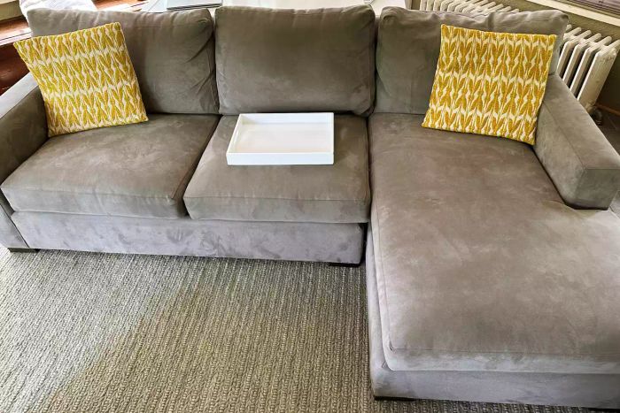 Crate & Barrel's Axis Sectional Sofa arranged in a living space with decorative throw pillows