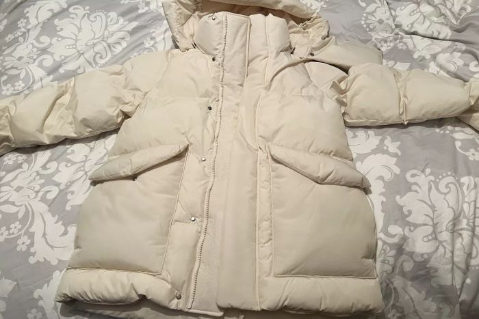 Halfdays Wheeler Parka displayed on a bed