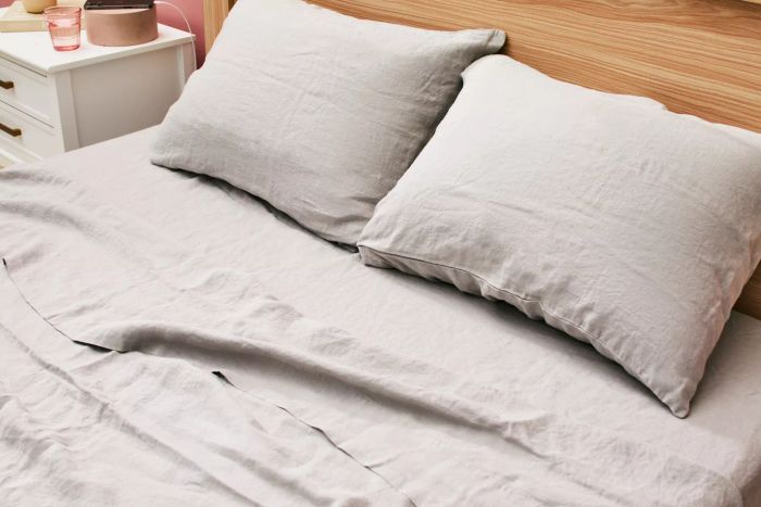 A bed made with the Delilah Home Hemp Sheet Set
