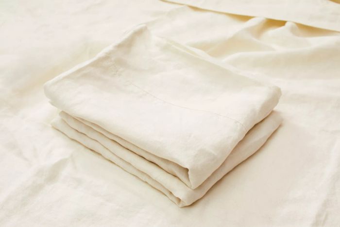Avocado Organic Hemp Sheets folded neatly in a pile.