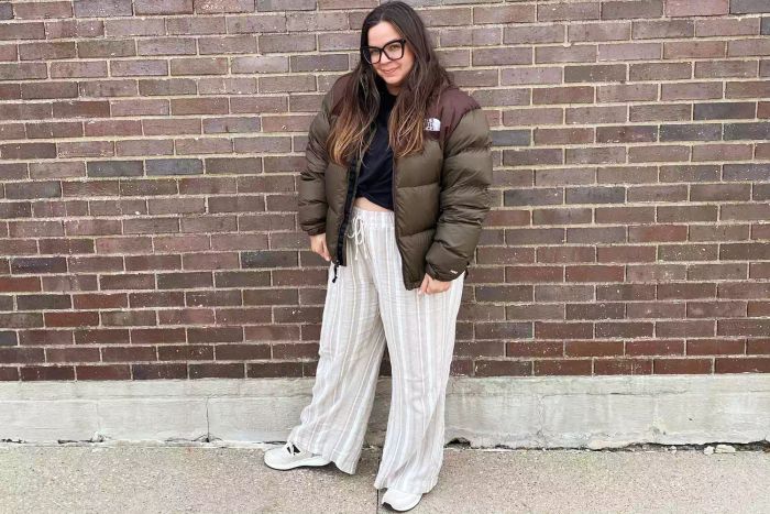 A woman wearing The North Face 1996 Retro Nuptse Down Jacket