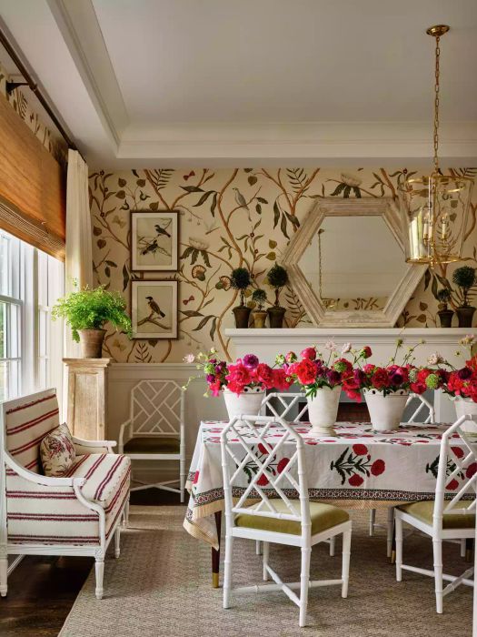 Topiaries positioned on the fireplace mantel.