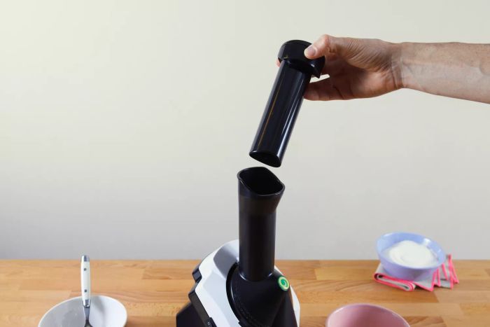 A person’s hand holding the lid of the Yonanas Classic Soft-Serve Dessert Maker