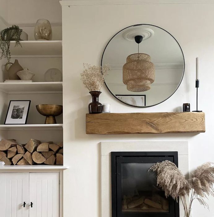 A fireplace mantel with neutral design elements