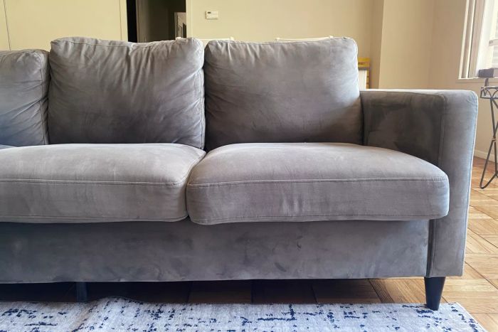 The Walmart DHP Cooper Sectional Sofa displayed in a living room