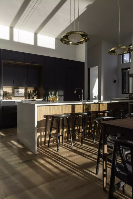A kitchen painted in a deep, sophisticated black.