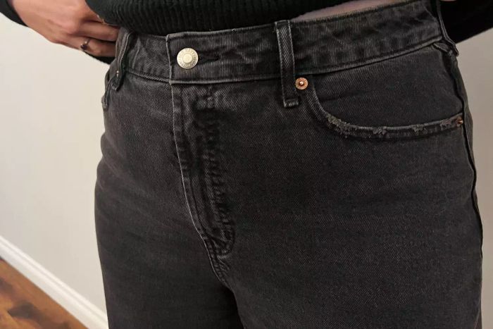 Close-up of the button and waistband of Old Navy Extra High-Waisted Wide-Leg Jeans for Women