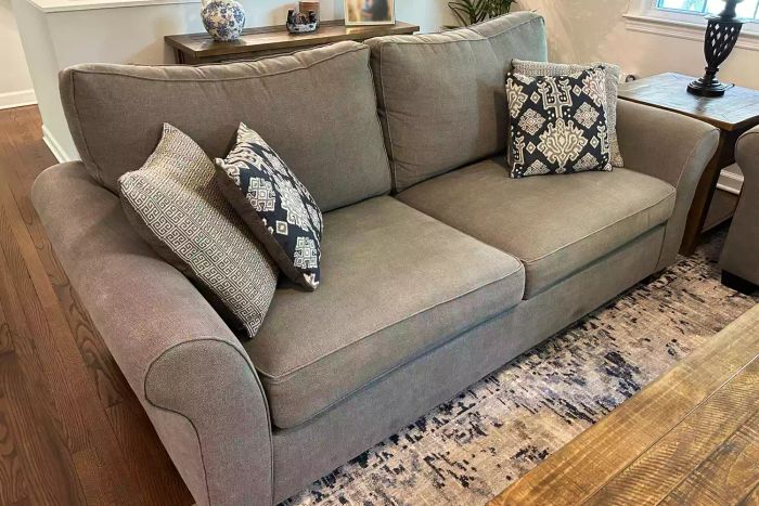 A living room showcasing the Pottery Barn PB Comfort Roll Arm Upholstered Sofa