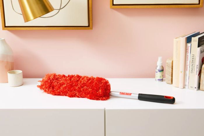 The OXO Good Grips Microfiber Extendable Duster resting on a table.