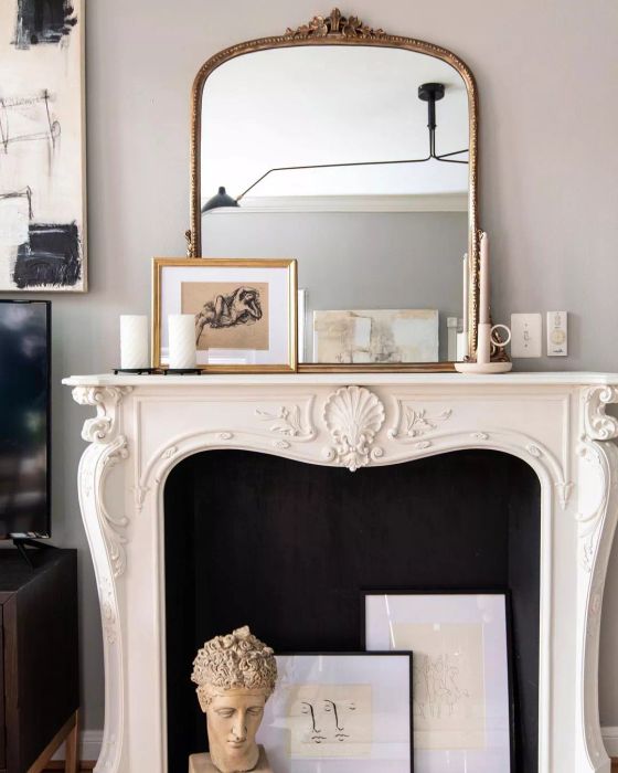 Art displayed in the base of the mantel